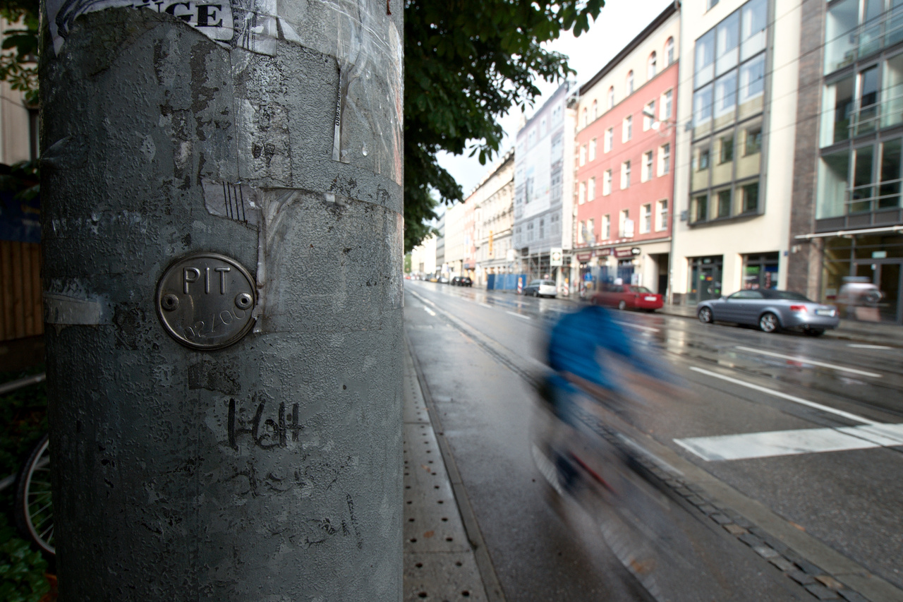 . Tagged with biker, lantern post, motion blur, reflection, wideangle