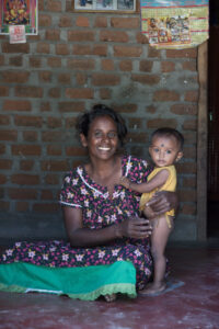 Click to enlarge: Mother and Son, Kodumavadu [f/4.5, 1/80 sec, 50mm-e, ISO 800, Sony A700]