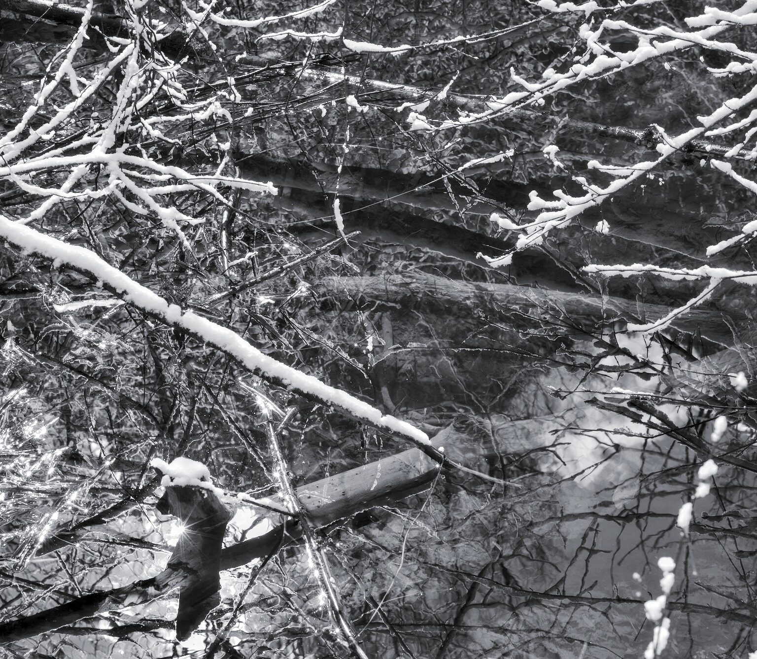 Late snow reflected in the Backwaters