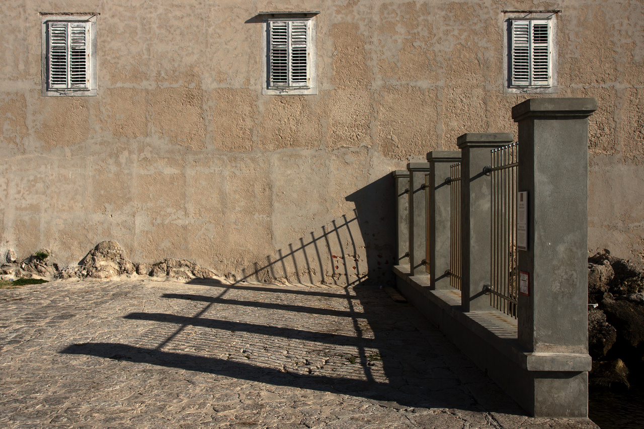 Leaning Fence and Facade Shadow