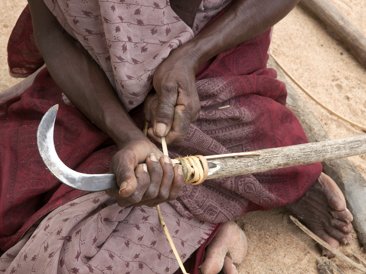Countrywoman Fixing Her Tool
